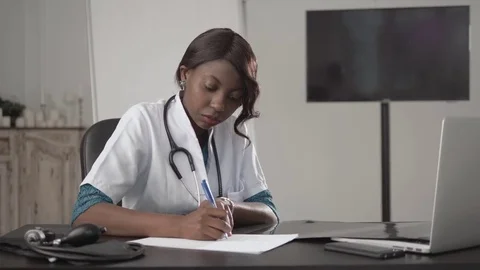 Medicine, people and healthcare concept - happy female african american doctor Stock Footage