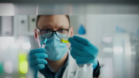 Medicine preparation process. The anesthesiologist wearing protective gloves Stock Footage 262278232