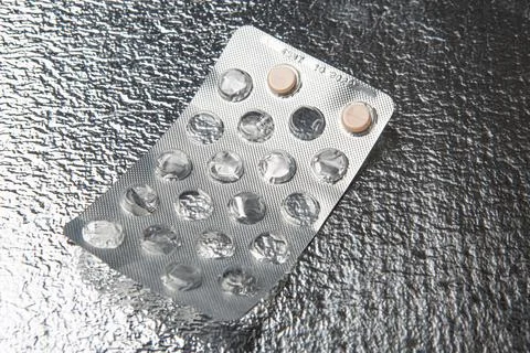 Medicine on silver colored background Stock Photos