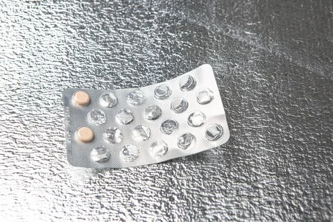 Medicine on silver colored background Stock Photos