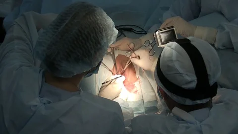 Medicine.the surgeon performs an operation on the labia. gynecological chair Stock-Footage 125584465