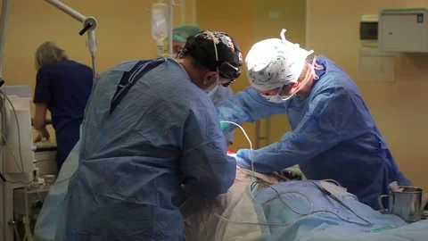 Medicine. two surgeons during the operation. average plan Video stock 77413342
