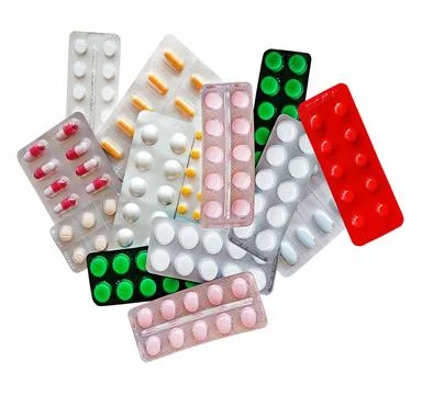 Medicines in the form of multi-colored tablets in blisters Stock Photos