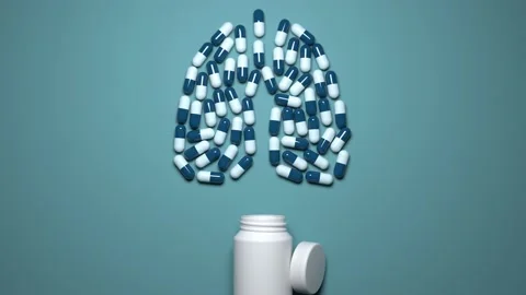 Medicines, multi-colored capsules pour out of a jar forming a lung icon Stock Footage 131067285