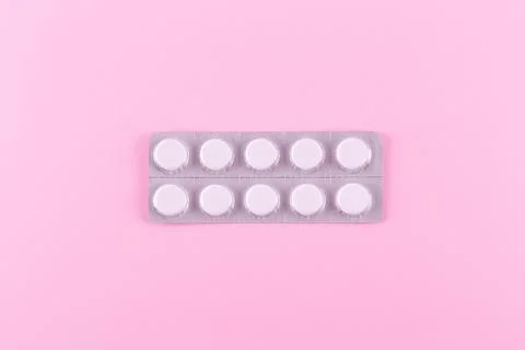 Medicines in packaging on a pink background. Flatlay. women's health, treat.. Stock Photos