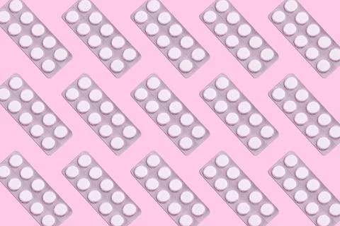 Medicines in packaging on a pink background. Flatlay. women's health, treat.. Stock Photos