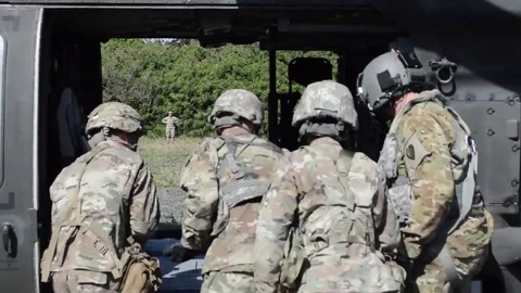 Medics loading casualty onto Black Hawk helicopter Video stock 84635443