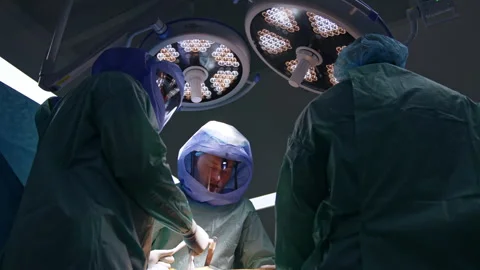 Medics perform arthroscopic surgery Stock Footage 241125614