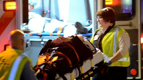 Medics Putting Patient into Ambulance Stock Footage