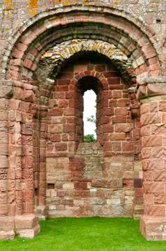 Medieval arched castle window. Stock Photos