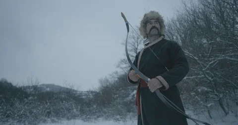 Medieval archer with a bow in the winter (S-log2) Stock Footage