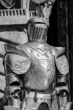 Medieval armor in front of a castle. Stock Photos