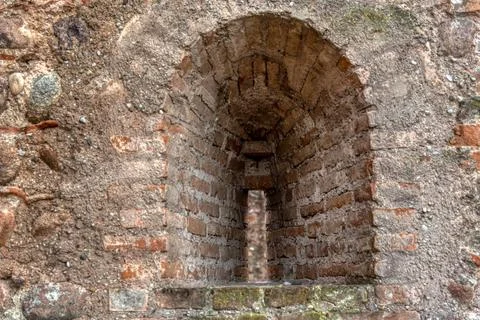 Medieval Arrow Slit Window in Brick Wall of Scaligero Castle Stock Photos