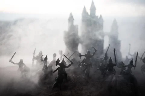 Medieval battle scene with cavalry and infantry. Silhouettes of figures as se Stock Photos