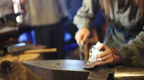 Medieval Blacksmith hitting Armor Stock Footage 44631898