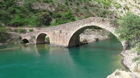 Medieval bridge over a river Stock Footage 116418155