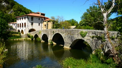 Medieval bridge over river Ulzama,Villava, Spain, Basque country, Navarra Stock Footage 130776501