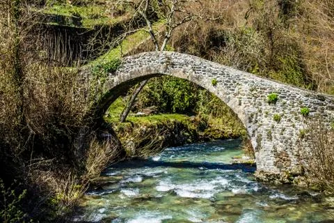 Medieval bridge on the stream of Equi Terme, ancient village in Tuscany, Italy Stock Photos