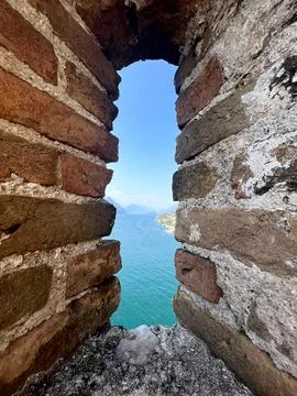 Medieval Castle Arrow Slit Window Framing Turquoise Lake Garda View Malcesine Stock Photos