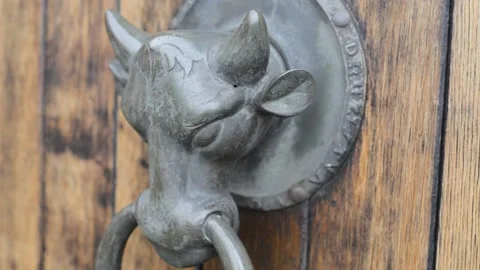 Medieval castle door knock knocker bull Video stock 145897241