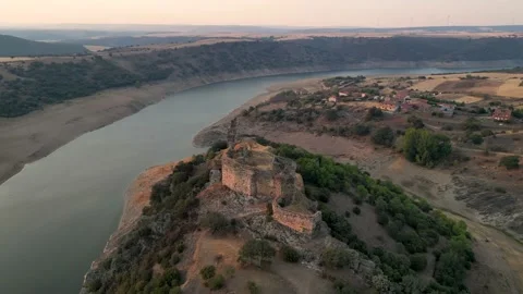 Medieval Castle Of On A Hill Overlooking River At Sunset Stock Footage 228645050