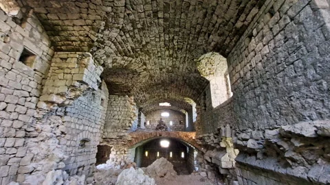 Medieval castle interior - ruin of old derelict stone fortress with partially Stock Footage 232729166