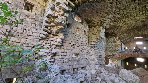 Medieval castle interior - ruin of old derelict stone fortress with partially Stock Footage 232732367