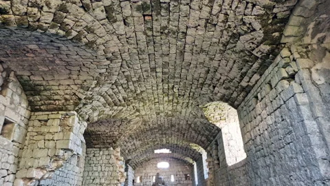 Medieval castle interior - ruin of old derelict stone fortress with partially Stock Footage 232736670