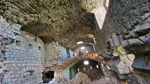 Medieval castle interior - ruin of old derelict stone fortress with partially Stock Footage 232738962
