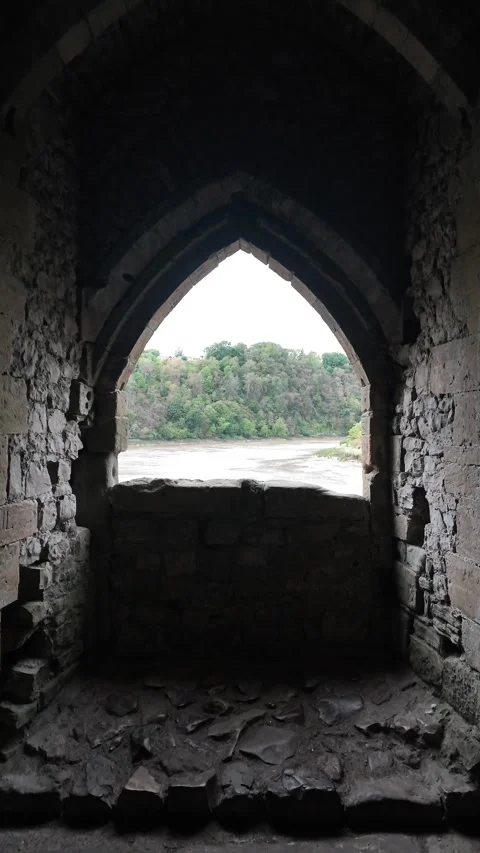 Medieval Castle Stone Window Arch Looking Out to River and Forest. vertical Stock Footage 345866068