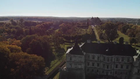 Medieval Castle Surrounded by Autumn Forest Stock Footage 99548551