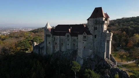 Medieval castle on top of the cliff with forest around it, Castle Liechtenstein Stock Footage 342937588