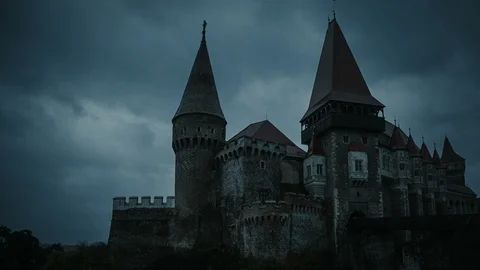 Medieval Castle at twilight with stormy clouds on background - pan shot Stock Footage