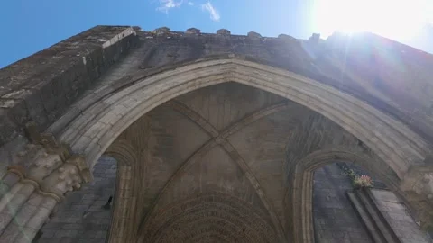 Medieval cathedral in the city of Tui with the sun entering between the towers, Stock Footage 286243402