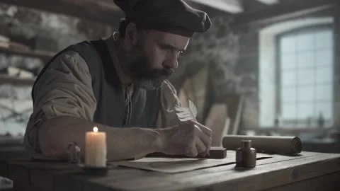 Medieval craftsman drawing a line with a quill pen using a wooden square Stock Footage 337929751