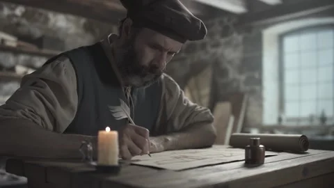Medieval craftsman reviewing a flying machine blueprint after lettering notes 動画素材 341734708