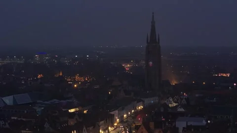 Medieval Dark Drone Orbit Over Bruges with Church of Our Lady Stock Footage 325531219
