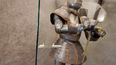Medieval decorated knight's armor with a two-handed sword - castle museum Stock Footage 314108274