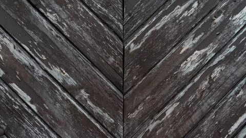 Medieval diagonal stripes pattern. An old riveted door made of wooden boards. Stock Photos