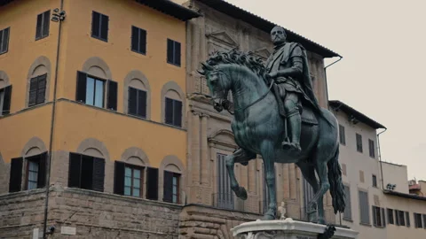 Medieval equestrian monument of Cosimo I against old buildings Florence Italy Stock Footage 306881816