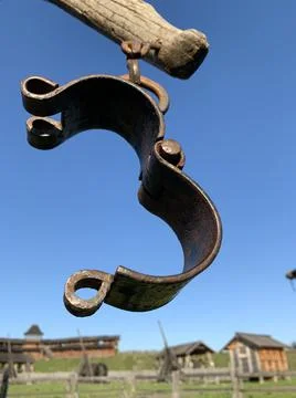 Medieval execution weapon. Chain with shackles for torture. Tools for the Inq Stock Photos