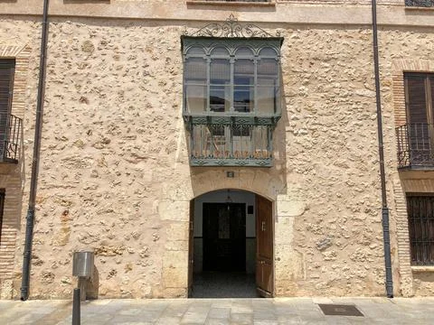 Medieval facade with projecting balcony. Stock Photos