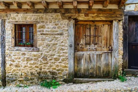 Medieval facade of stone house in Calatanazor, Soria, Spain. Stock Photos