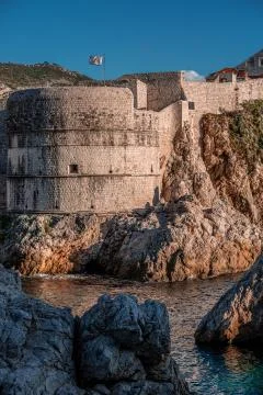 Medieval fort with round tower inside ancient brick walls Stock Photos