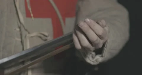Medieval handgunner loading leadshot into matchlock musket #1 Stock Footage 148038419