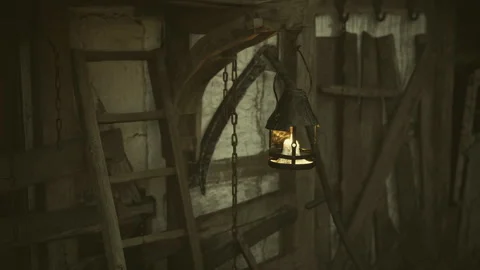 Medieval inspired lantern casting soft glow on aged wooden surfaces Stock Footage 338342746