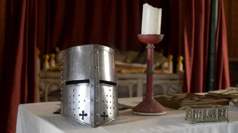 Medieval interior with details and objects. Action. Silver knight's helmet and Stock Footage 120325248