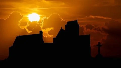 Medieval Iona Abbey, Time Lapse at Sunset with Red Sky and Fiery Sun, Scotland Stock Footage 196674611
