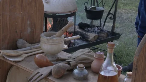 Medieval kitchen utensils and containers, bread bakes in a portable oven. Video stock 76267495