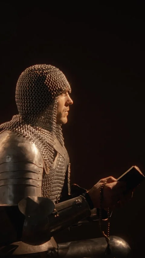 Medieval Knight in Chainmail Armor Praying with Holy Scripture Stock-Footage 345522023